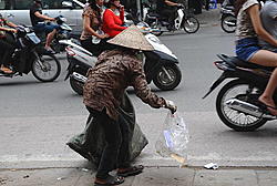 Click image for larger version

Name:	woman-collects-recyclable-items-along-a-busy-street-in-downtown-hanoi-picture-id152341292.jpg
Views:	0
Size:	100.1 KB
ID:	1901095